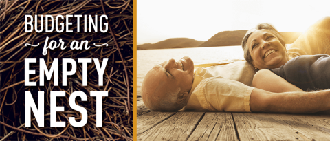 elder couple relaxing on a lake dock with text overlay “Budgeting for an empty nest”